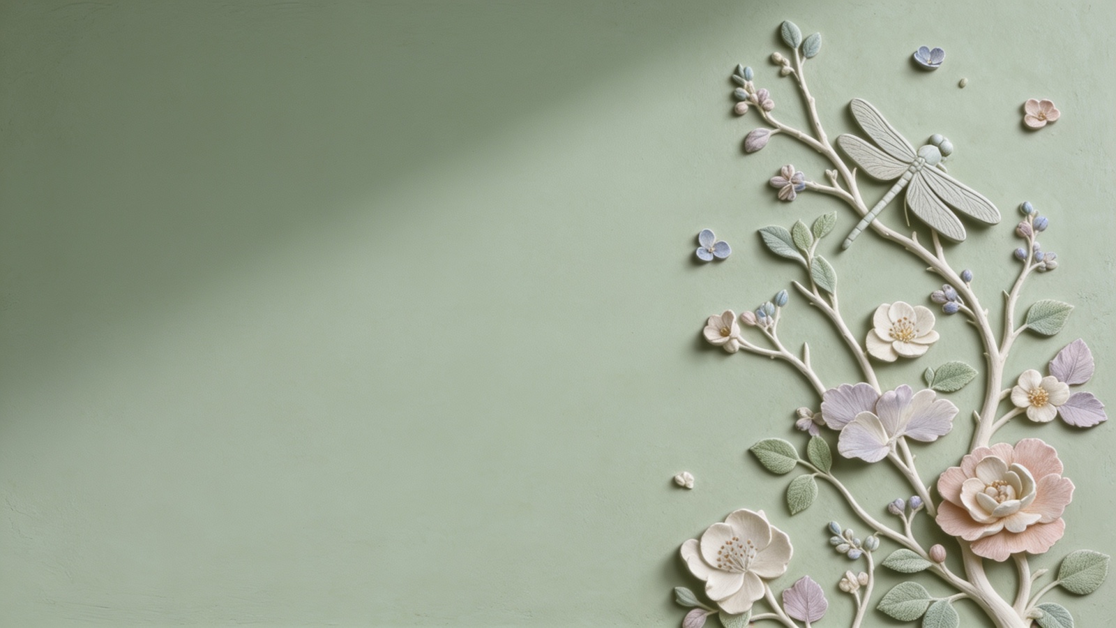 A hand-sculpted plaster relief of a dragonfly on a sage-green ground
